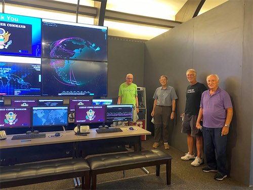 Members of the Lone Star LMAG tour the cybersecurity center exhibit.